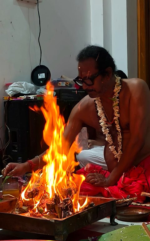 Homa fire tended by Sri Meenananda Tirthanath.