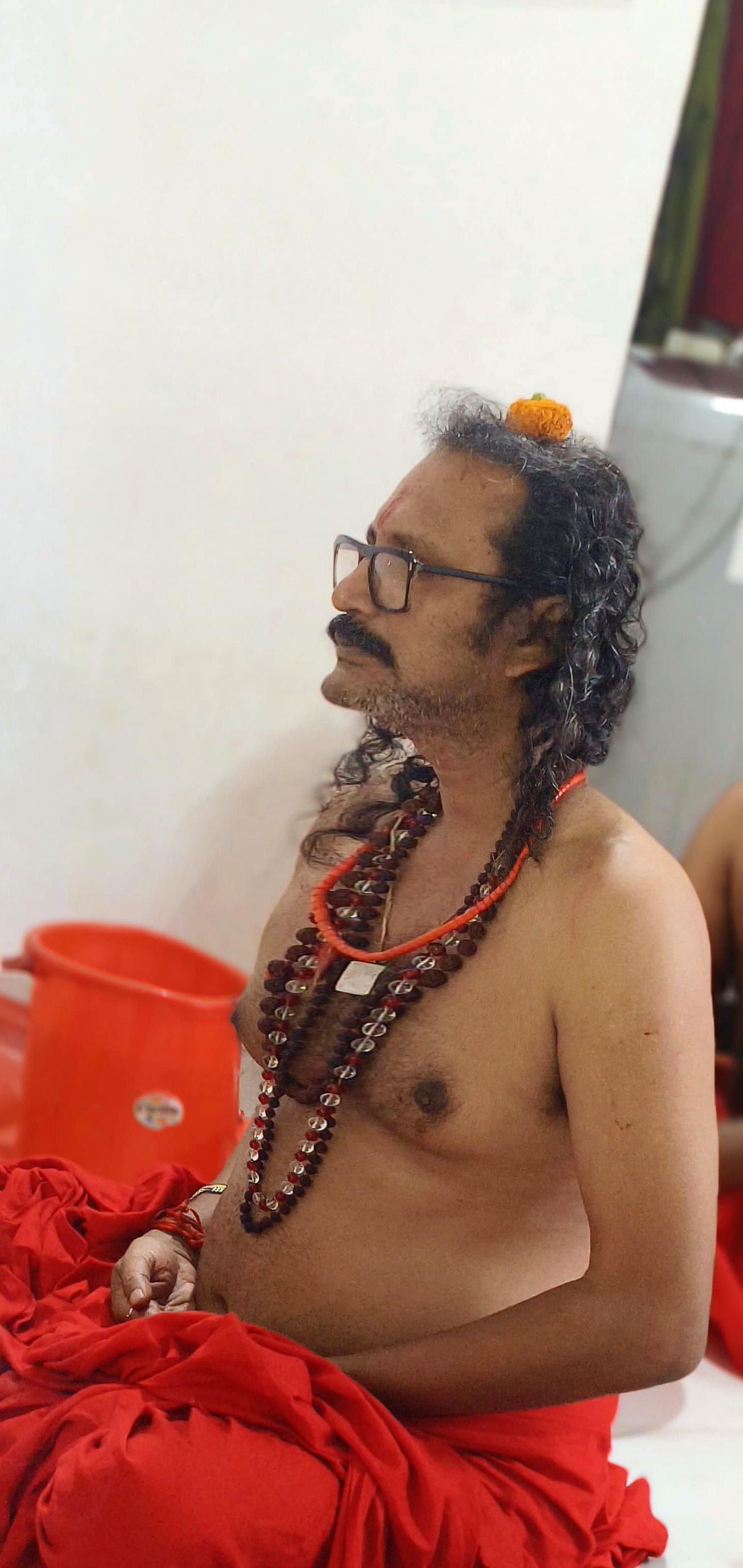 Sri Meenananda Tirthanath seated in dhyana during puja.